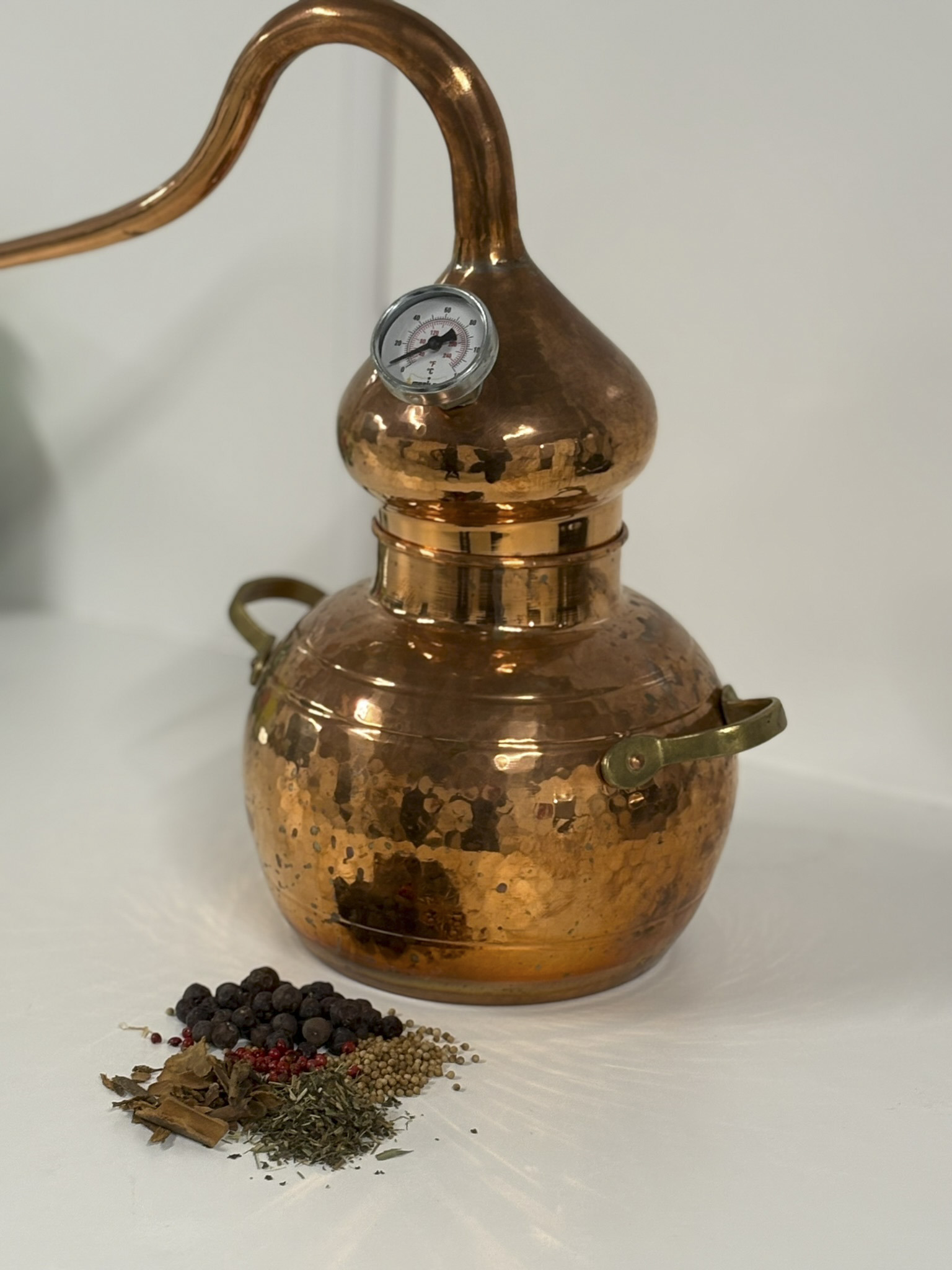copper still with botanical display